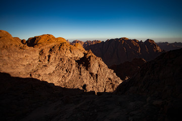 Mountains lit by first rays of sun at sunrise.