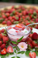 Strawberry milk and rose on wood table