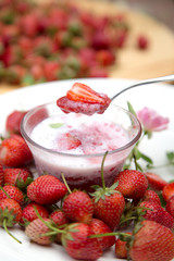 Strawberry milk and rose on wood table