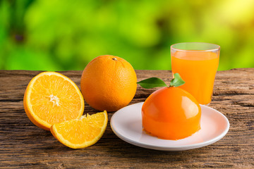 Orange cake and Glass of Fresh Orange Juice on grunge wooden table