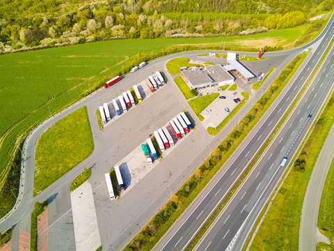 Aerial view of highway rest area with restaurant and large car park for cars and trucks. D5 motorway in west Bohemia, Czech republic, European union. Top view of highway infrastructure.