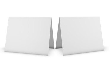 Two blank greeting cards, invitations  standing on white floor, isolated on white.