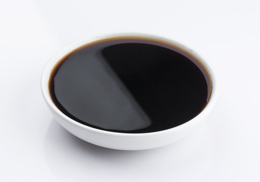 Plate of Soy sauce isolated on white background