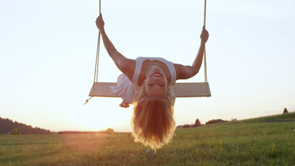 LENS FLARE CLOSE UP Lovely young lady's blonde locks flowing in air as she sways