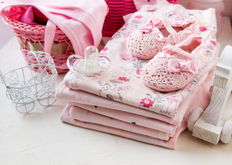 Baby clothes for newborn. In pink colors for girls. Tone pink.