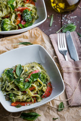 Pasta with green vegetables and creamy sauce
