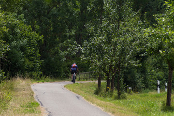 cyclists exercising on a bikeway © rudolfgeiger