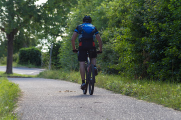 cyclists exercising on a bikeway © rudolfgeiger