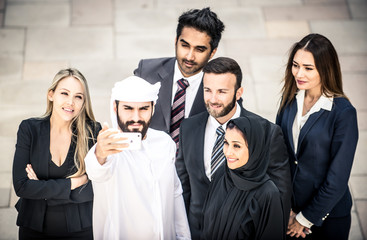 Arabic and western business people portrait. Motivational concept