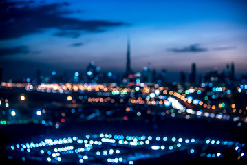 Naklejka premium Niewyraźne widok z lotu ptaka Dubaju nocą