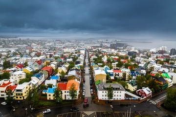 Icelandic capital panorama, streets and colorful resedential buildings with fjord and mountains in the background, Reykjavik, Iceland