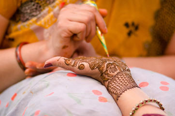applying henna on hand, Hindu wedding ,Rajasthan, India