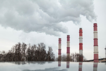 Pipes emit smoke. factory pipes with emit harmful smoke