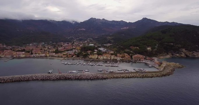 Aerial, a little port of Marciana Marina on Elba island in Tuscany, Italy on a cloudy day
