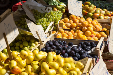Fruit boxes with plums and peaches