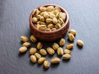 Pistachios on stone background