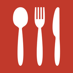 Knife, fork and spoon on red background.