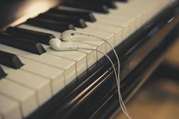 Fototapeta na wymiar Headphones on the piano keyboard