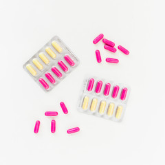 Healthy concept with vitamins on white background. Flat lay, top view. Medical concept
