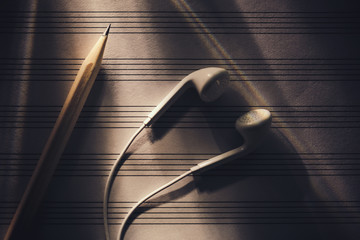 Earphones on the sheet music