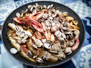 Italy March 2018 - fish soup or fish soup, dish type poor fisherman but now very sought after dish in Italian cuisine. Clams, blue fish and crustaceans can be noticed