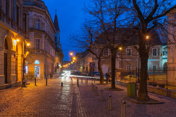 Fototapeta na wymiar Beautiful street in the evening in Sibiu, Romania