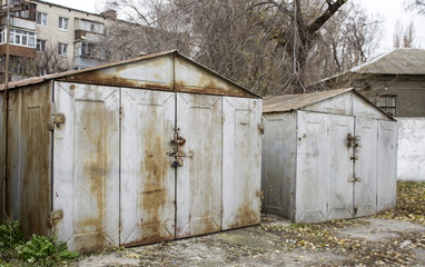 Old abandoned garages gray metallic and rusty