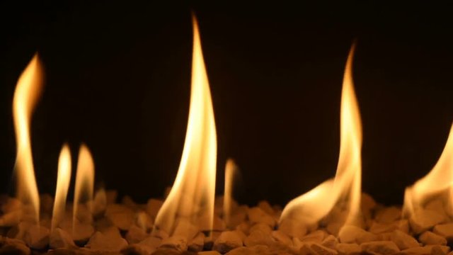 Gas fireplace with burning fire, loop-ready backdrop