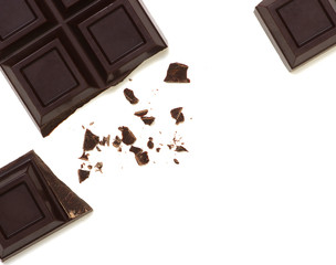 Broken chocolate bar isolated on white