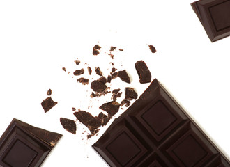 Broken chocolate bar isolated on white