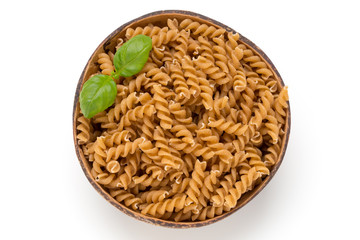 Uncooked wholemeal pasta isolated white background.