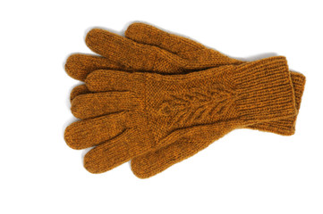 Yellow handmade gloves on white background. View from above.