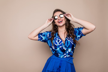 Pretty young sexy fashion sensual woman posing on color wall background. Stylish fashionable blonde girl summer clothes.