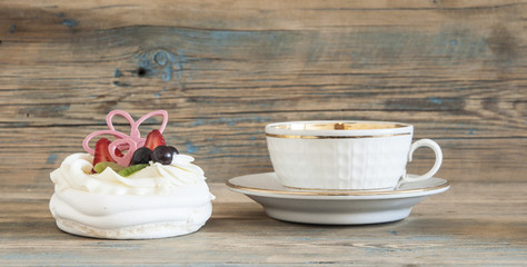 Cupcake on wooden table.