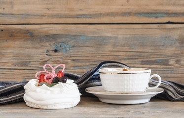 Cupcake on wooden table.