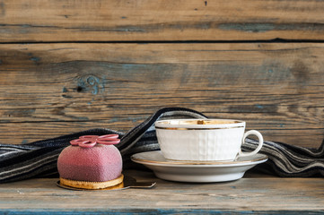 Cupcake on wooden table.