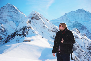 Fototapeta na wymiar Man with camera at Mannlichen mountain