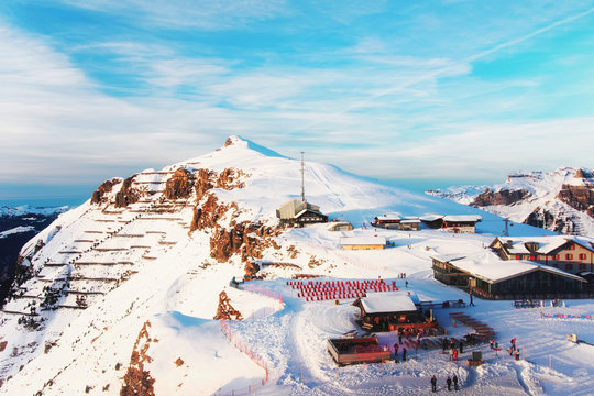 Mannlichen mountain and resort with tourists in winter Swiss Alps