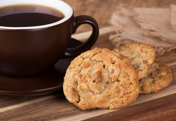 Peanut butter cookies next to a cup of coffee