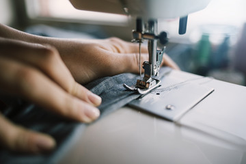  Fashion designer work on the sewing machine.