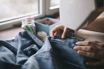  Fashion designer work on the sewing machine.