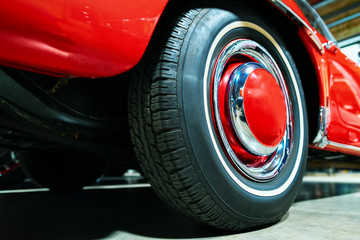 Wheel of red Retro car in the garage in Berlin