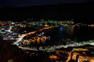 Fototapeta premium Night view of Kotor Fortress wall with heart-shape reflection