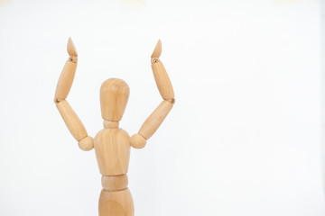A wooden manicure performs exercises of gymnastics. On a white background.
