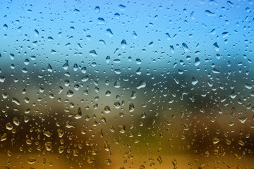 The texture of rain drops on the glass from the shower