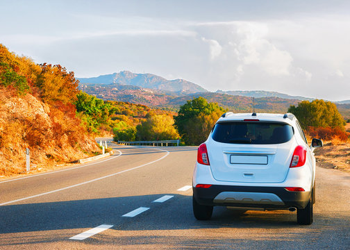 White car on road in Costa Smeralda Sardinia