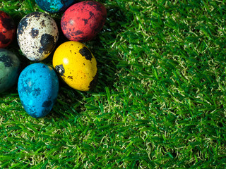 colorful of easter eggs placed on green grass. Easter day concept. copy space for text