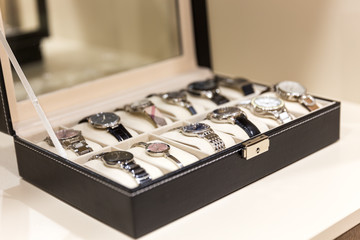 Collection of  ladies wrist watches in storage box
