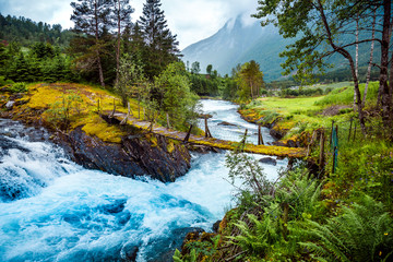 Suspension bridge over the mountain river, Norway.