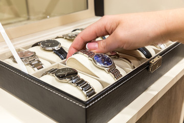 Collection of  ladies wrist watches in storage box